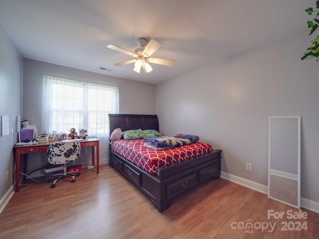 bedroom featuring hardwood / wood-style floors and ceiling fan