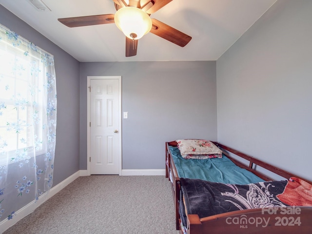 carpeted bedroom with ceiling fan