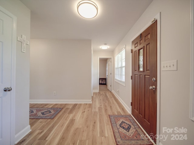 corridor featuring light hardwood / wood-style floors