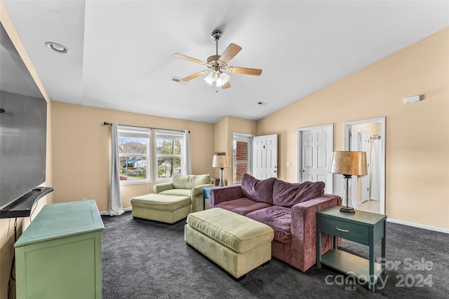 living room with ceiling fan, dark carpet, and lofted ceiling