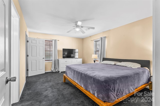 carpeted bedroom featuring ceiling fan