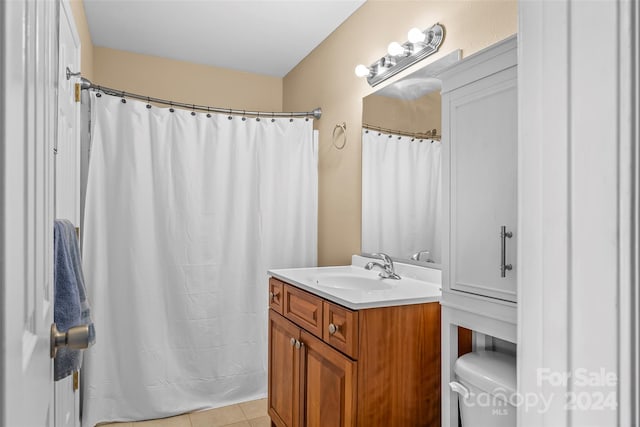 bathroom with tile patterned floors, vanity, and toilet