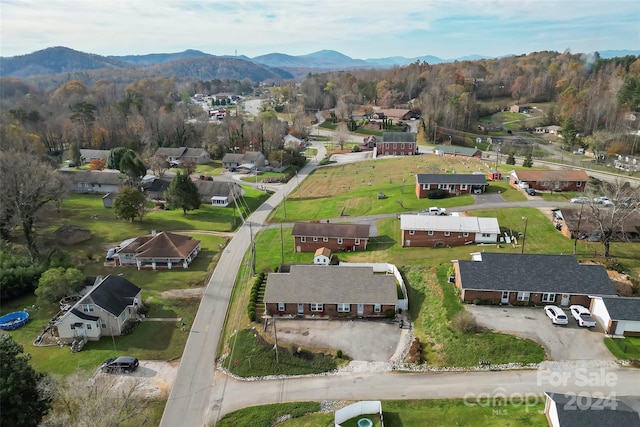 birds eye view of property with a mountain view