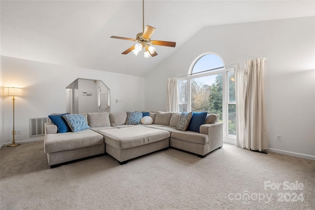 living room with light colored carpet, high vaulted ceiling, and ceiling fan