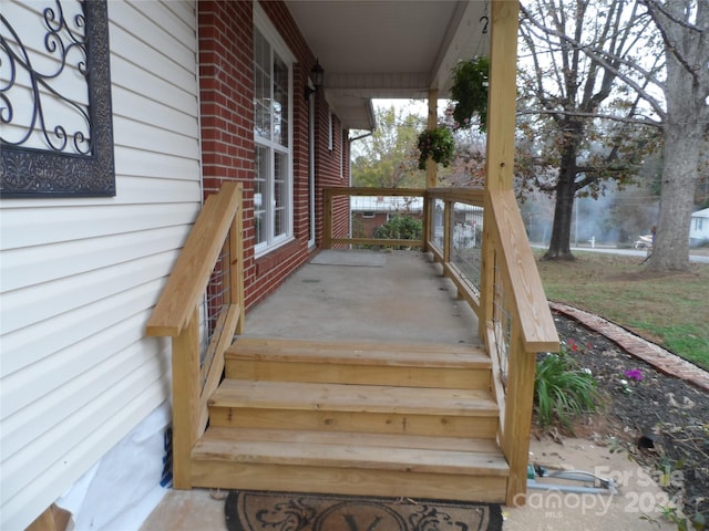 wooden deck featuring covered porch