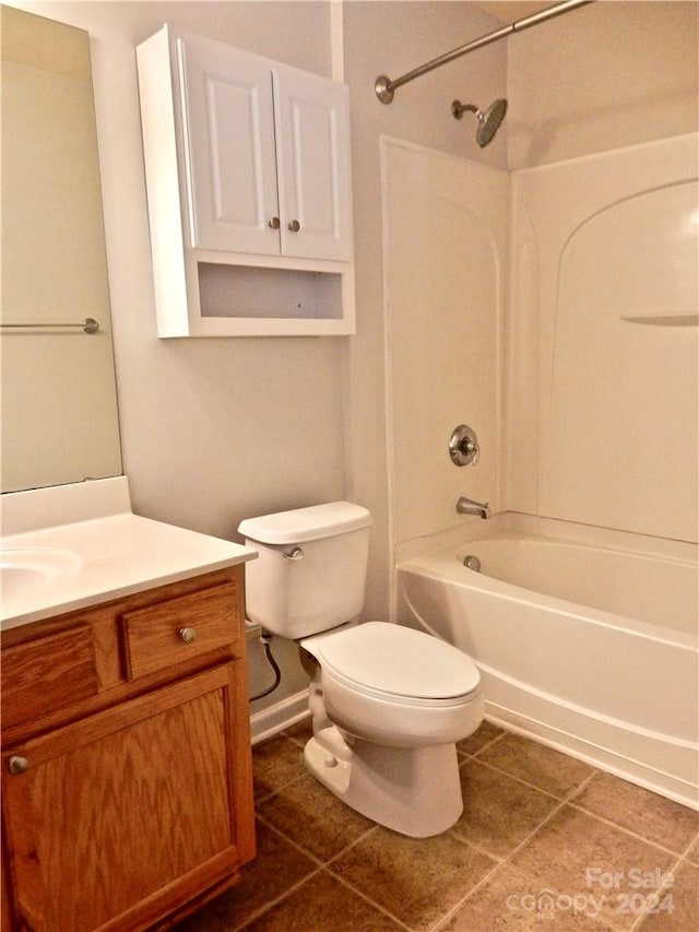 full bathroom with tile patterned floors, vanity, toilet, and shower / washtub combination