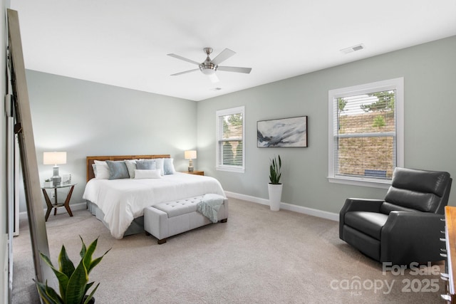 carpeted bedroom with ceiling fan