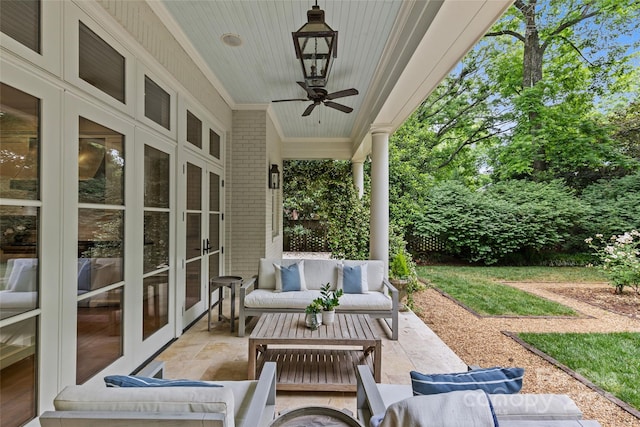 view of patio with french doors, an outdoor living space, and a ceiling fan