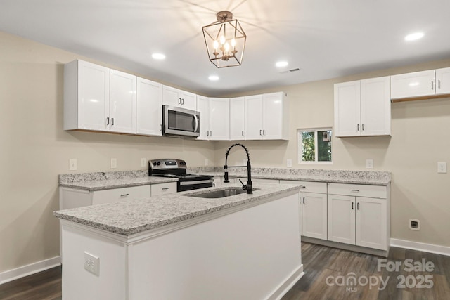 kitchen with white cabinets, stainless steel appliances, and sink