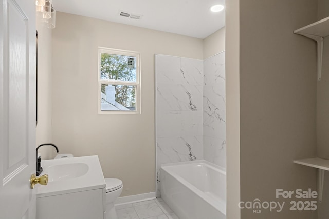 full bathroom with vanity, toilet, and tiled shower / bath combo