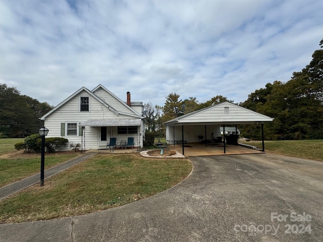 1716 3rd St NE, Hickory, NC 28601 - view of front of home with a carport and a front lawn