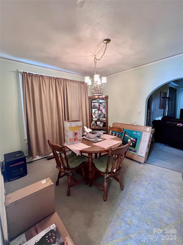 1716 3rd St NE, Hickory, NC 28601 - dining area featuring a chandelier, a textured ceiling, and carpet flooring