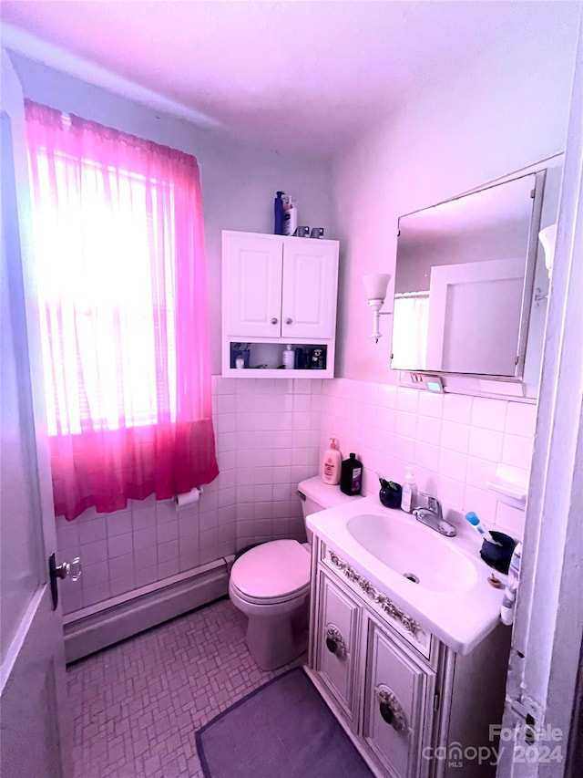 1716 3rd St NE, Hickory, NC 28601 - bathroom with vanity, toilet, tile walls, and a baseboard heating unit