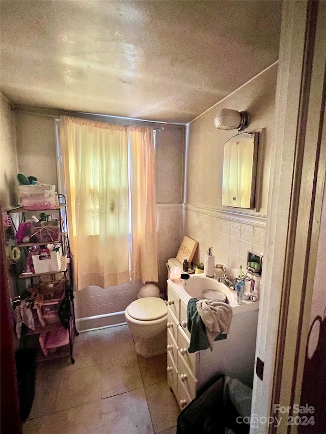1716 3rd St NE, Hickory, NC 28601 - bathroom featuring tile patterned floors, vanity, toilet, and tile walls