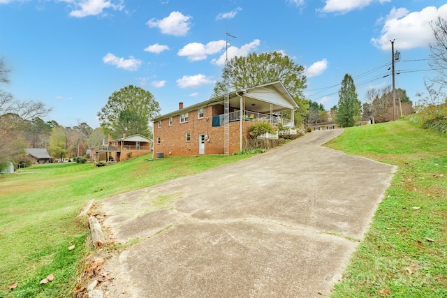 view of side of home featuring a yard