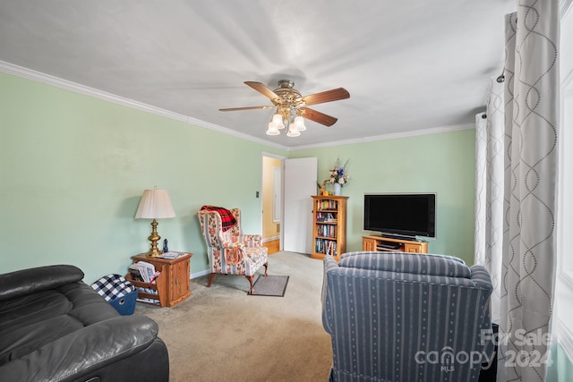 carpeted living room featuring ceiling fan and ornamental molding