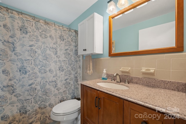 bathroom with a shower with curtain, vanity, tile walls, and toilet