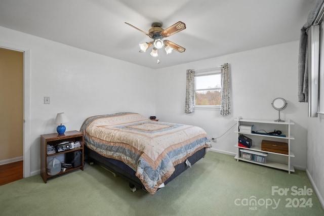 bedroom with ceiling fan and carpet