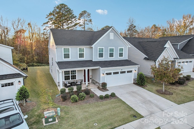 front of property featuring a garage and a front yard