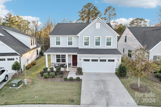 view of front property with a garage and a front lawn