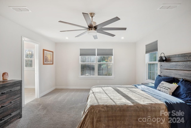 carpeted bedroom with ceiling fan