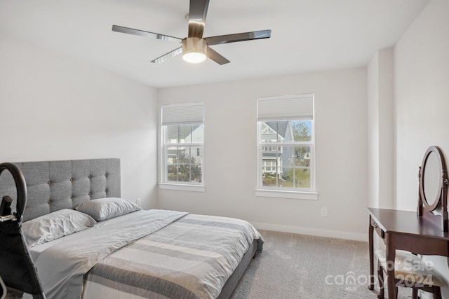 bedroom featuring ceiling fan and light carpet