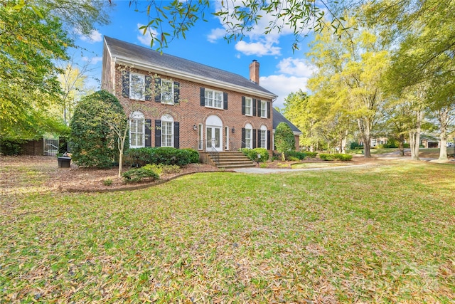 colonial-style house with a front yard