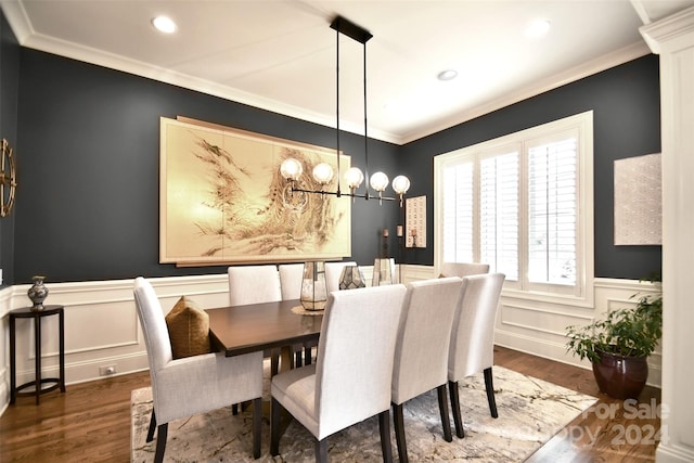 dining room featuring dark hardwood / wood-style flooring and ornamental molding