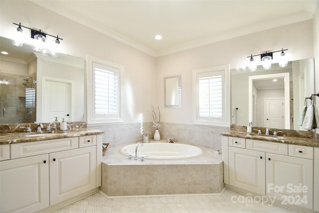 bathroom with plus walk in shower, vanity, a wealth of natural light, and crown molding