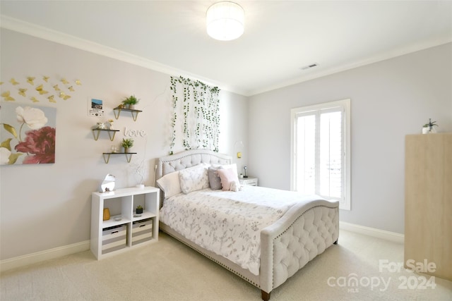 carpeted bedroom featuring ornamental molding