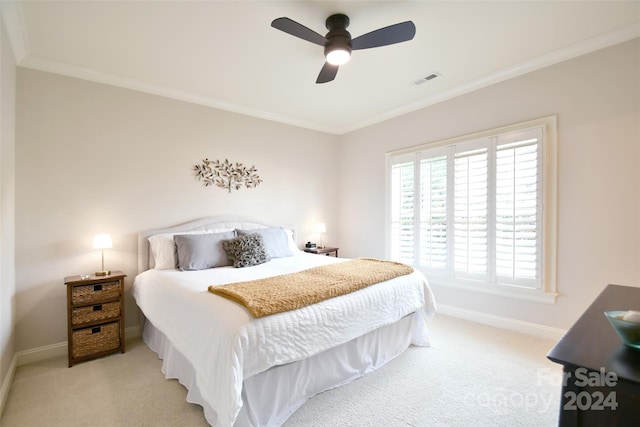 bedroom featuring light carpet, ceiling fan, and ornamental molding