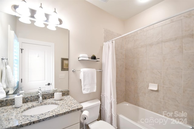 full bathroom featuring shower / bathtub combination with curtain, vanity, and toilet