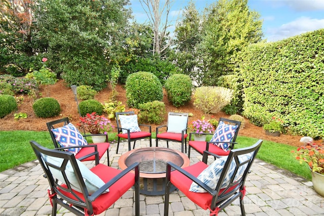 view of patio / terrace with an outdoor fire pit