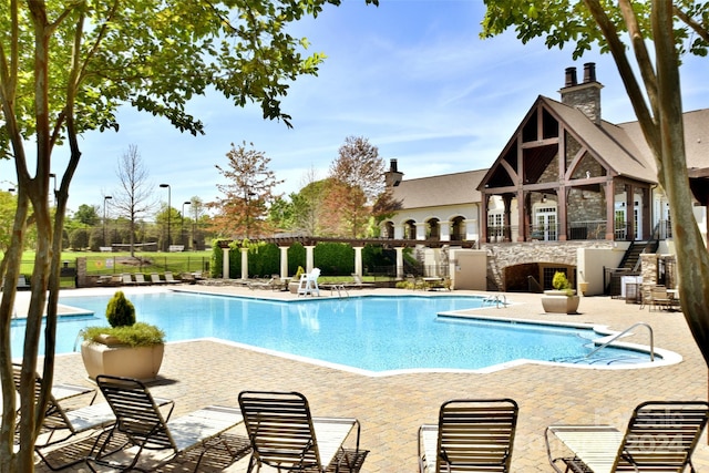 view of swimming pool with a patio