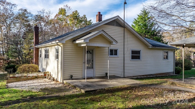 rear view of property featuring a patio