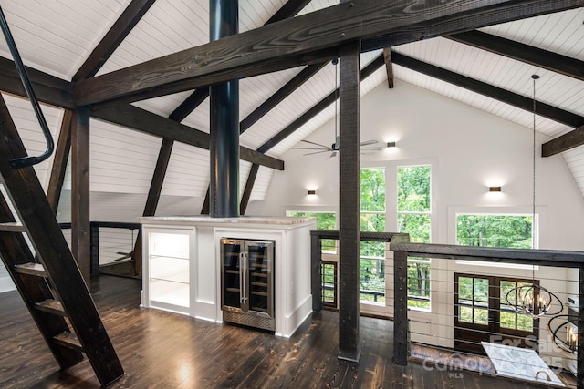 unfurnished living room featuring beam ceiling, wine cooler, high vaulted ceiling, and wood-type flooring