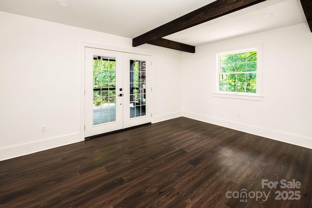 spare room with baseboards, french doors, plenty of natural light, and beamed ceiling