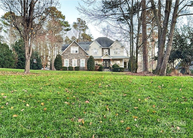 view of front of property with a front lawn