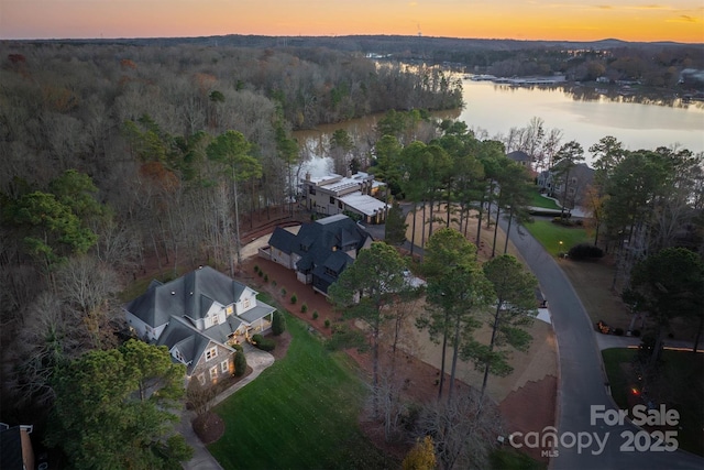 aerial view at dusk with a water view