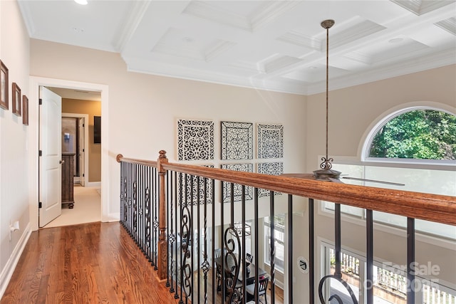 hall featuring wood-type flooring, coffered ceiling, crown molding, and beam ceiling