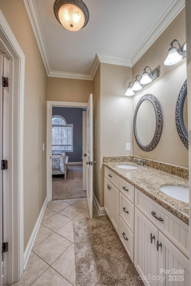 bathroom featuring tile patterned flooring, ornamental molding, and vanity