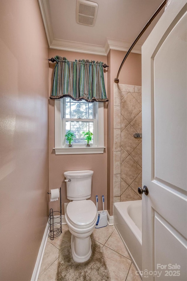 bathroom featuring ornamental molding, tile patterned floors, and toilet