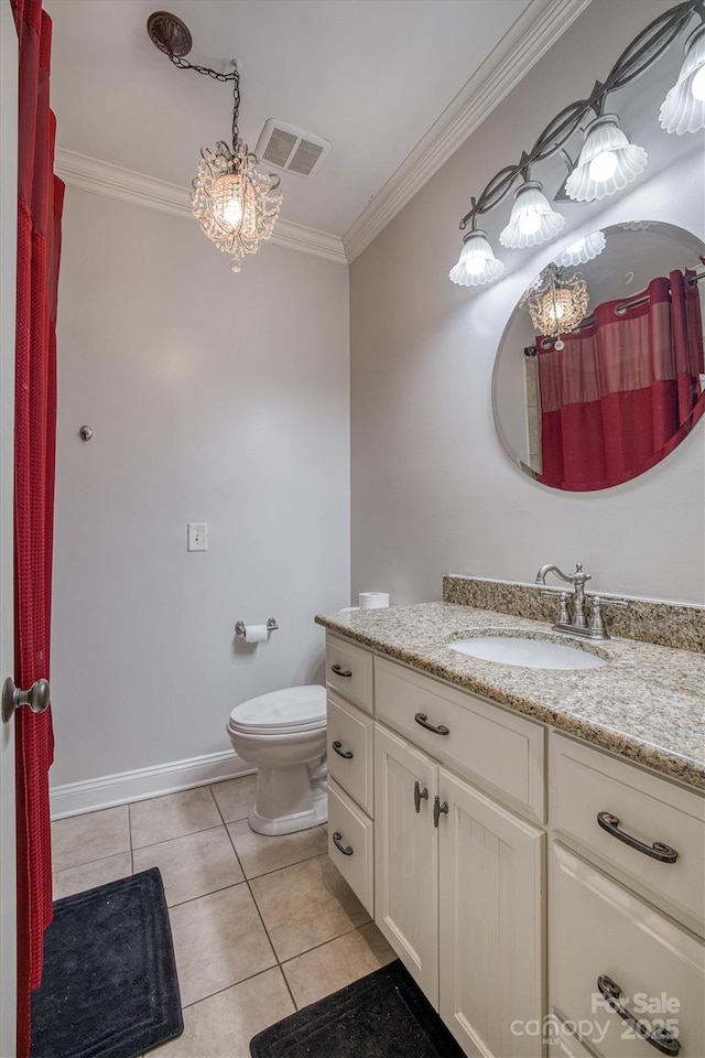 bathroom with ornamental molding, toilet, tile patterned flooring, and vanity