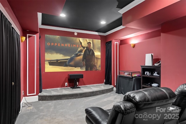 carpeted home theater room with ornamental molding