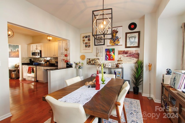 dining room featuring a chandelier and dark hardwood / wood-style floors