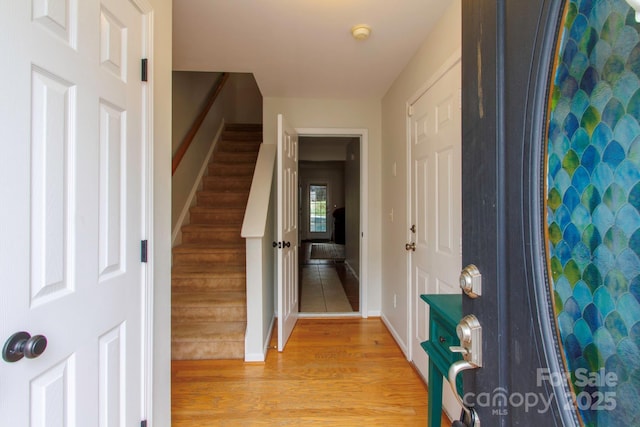 foyer with light hardwood / wood-style flooring