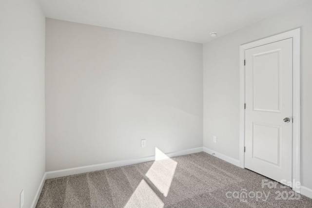 unfurnished room with carpet flooring