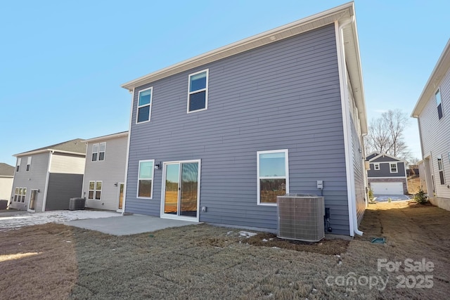 back of house with a patio area and central air condition unit