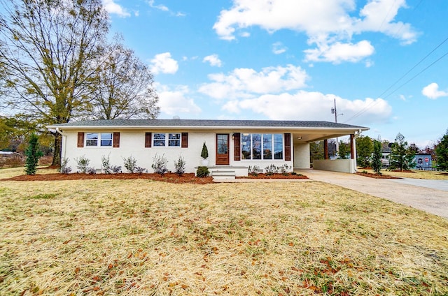 ranch-style house featuring a front yard and a carport