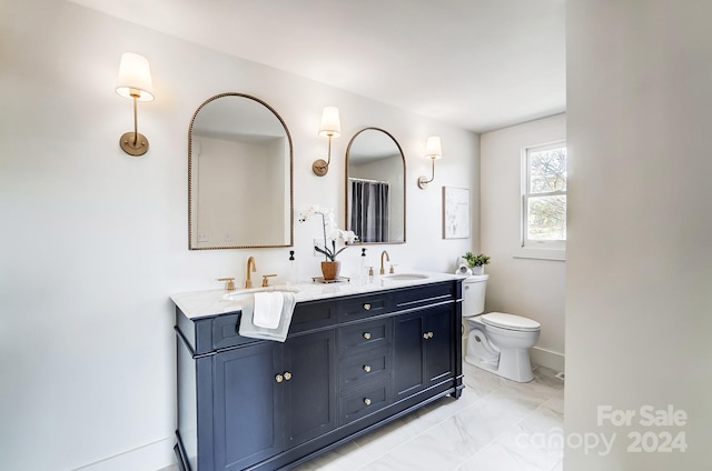 bathroom with vanity and toilet